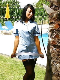 Penelope the dark haired beauty in a nurse uniform with..