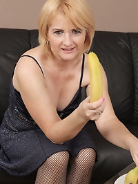 Horny busty blonde Jennyfer B uses a banana for pleasure