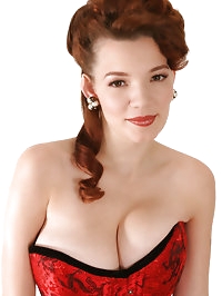 Danielle poses in a red corset