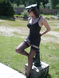 Jane poses outside in lingerie and stockings