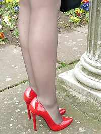 Hot and sexy Cheryl shows off her fabulous red stilettos..